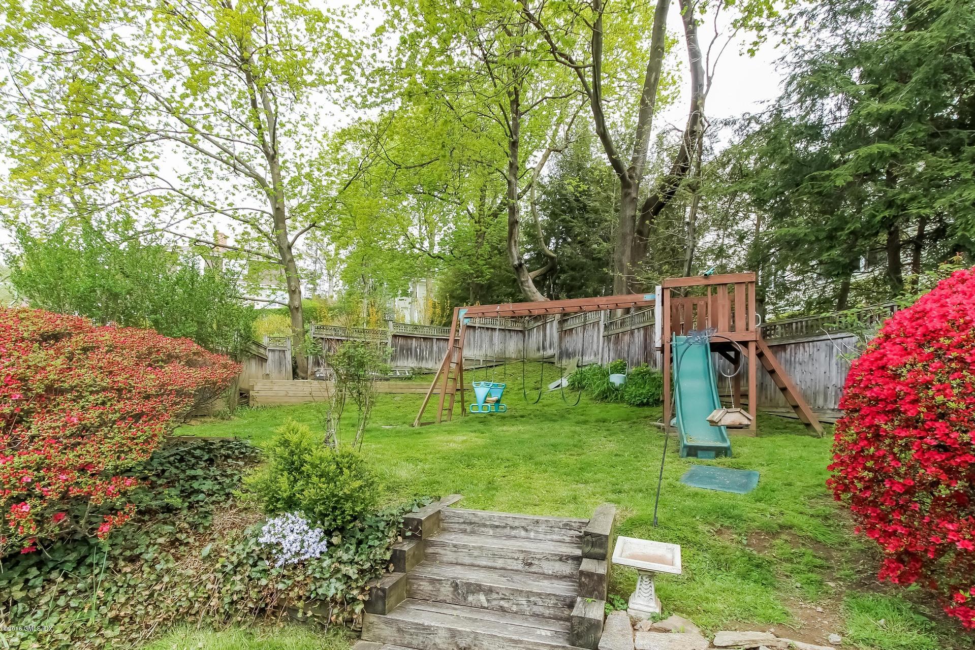 3 Idlewild Manor Greenwich, CT 06830 - Photo 20 of 26 a view of a garden with a slide