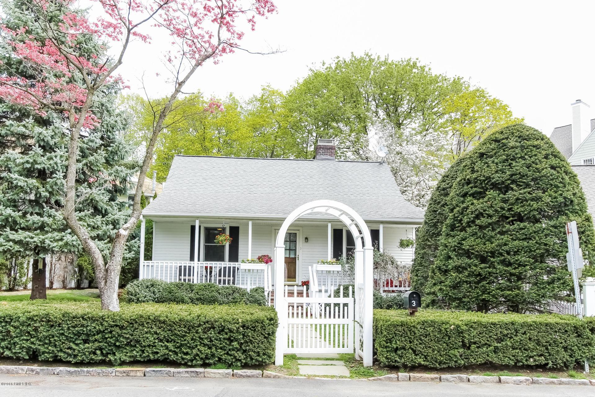 3 Idlewild Manor Greenwich, CT 06830 - Photo 23 of 26 a front view of a house with a yard