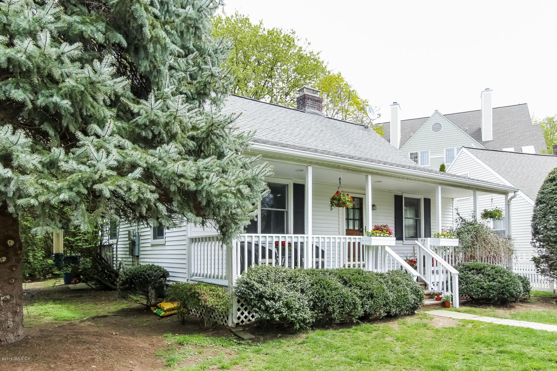 3 Idlewild Manor Greenwich, CT 06830 - Photo 24 of 26 a view of a house with a yard and plants