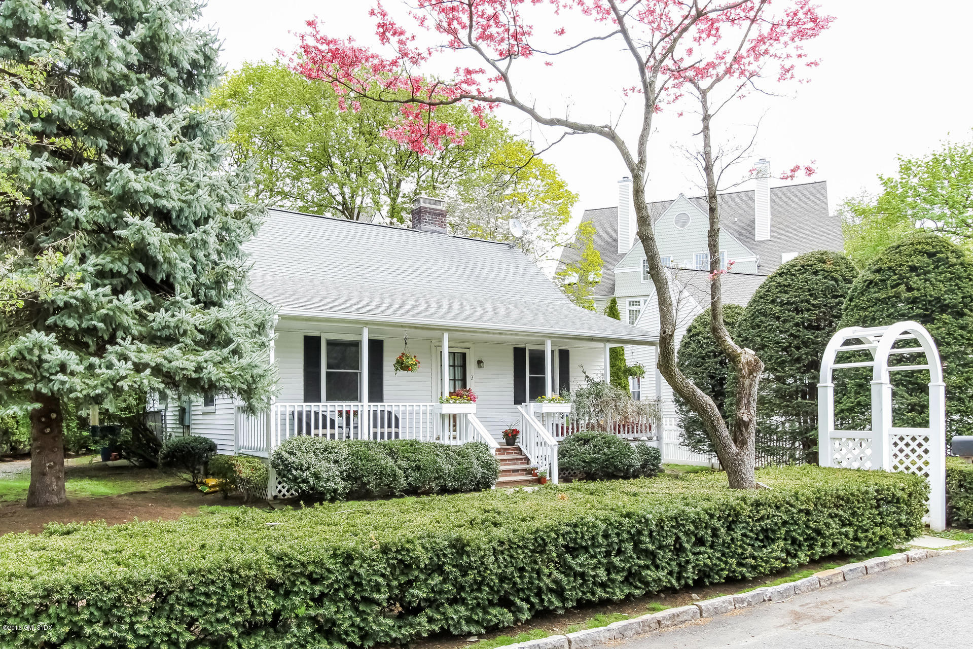 3 Idlewild Manor Greenwich, CT 06830 - Photo 25 of 26 front view of a house with a yard