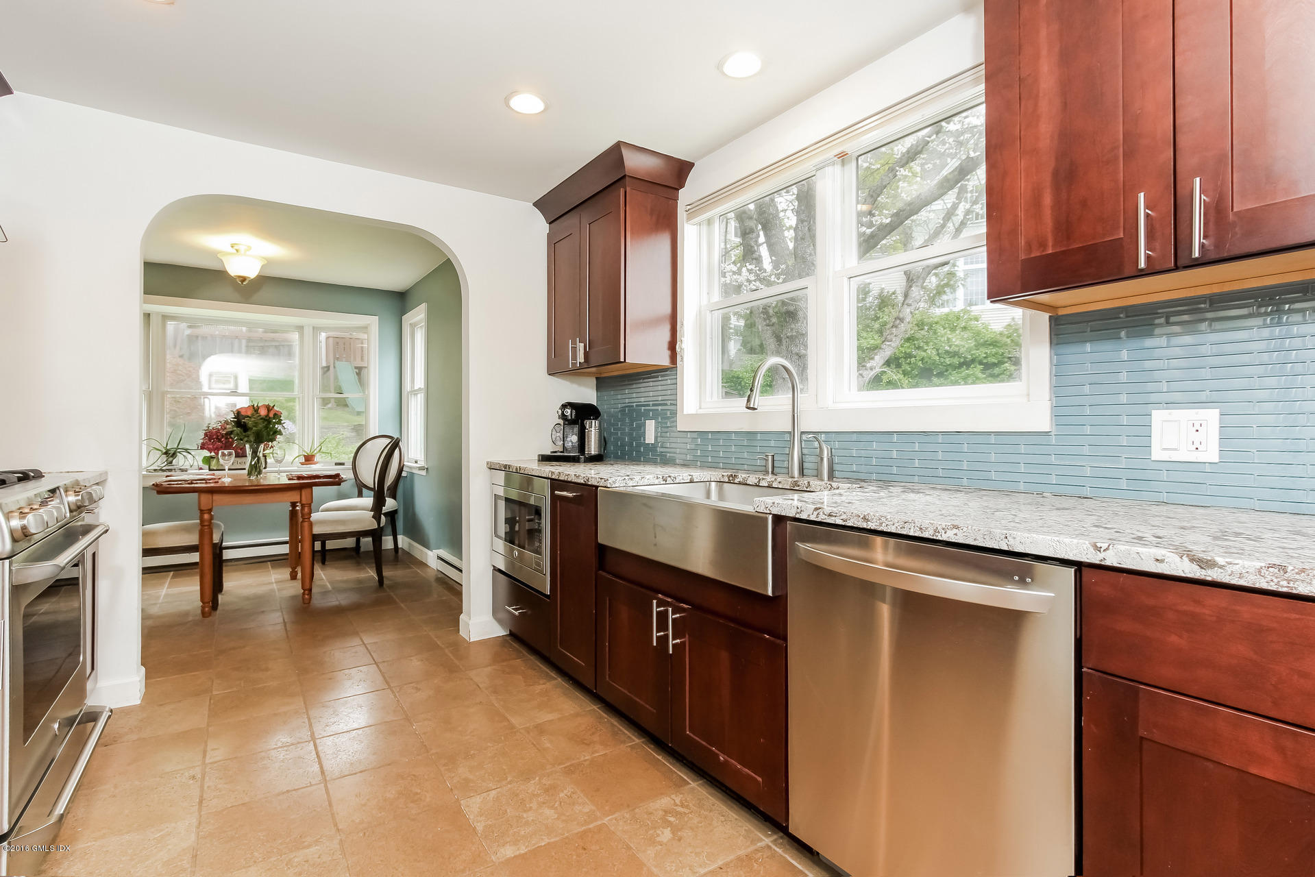 3 Idlewild Manor Greenwich, CT 06830 - Photo 4 of 26 a kitchen with stainless steel appliances granite countertop sink stove top oven and cabinets