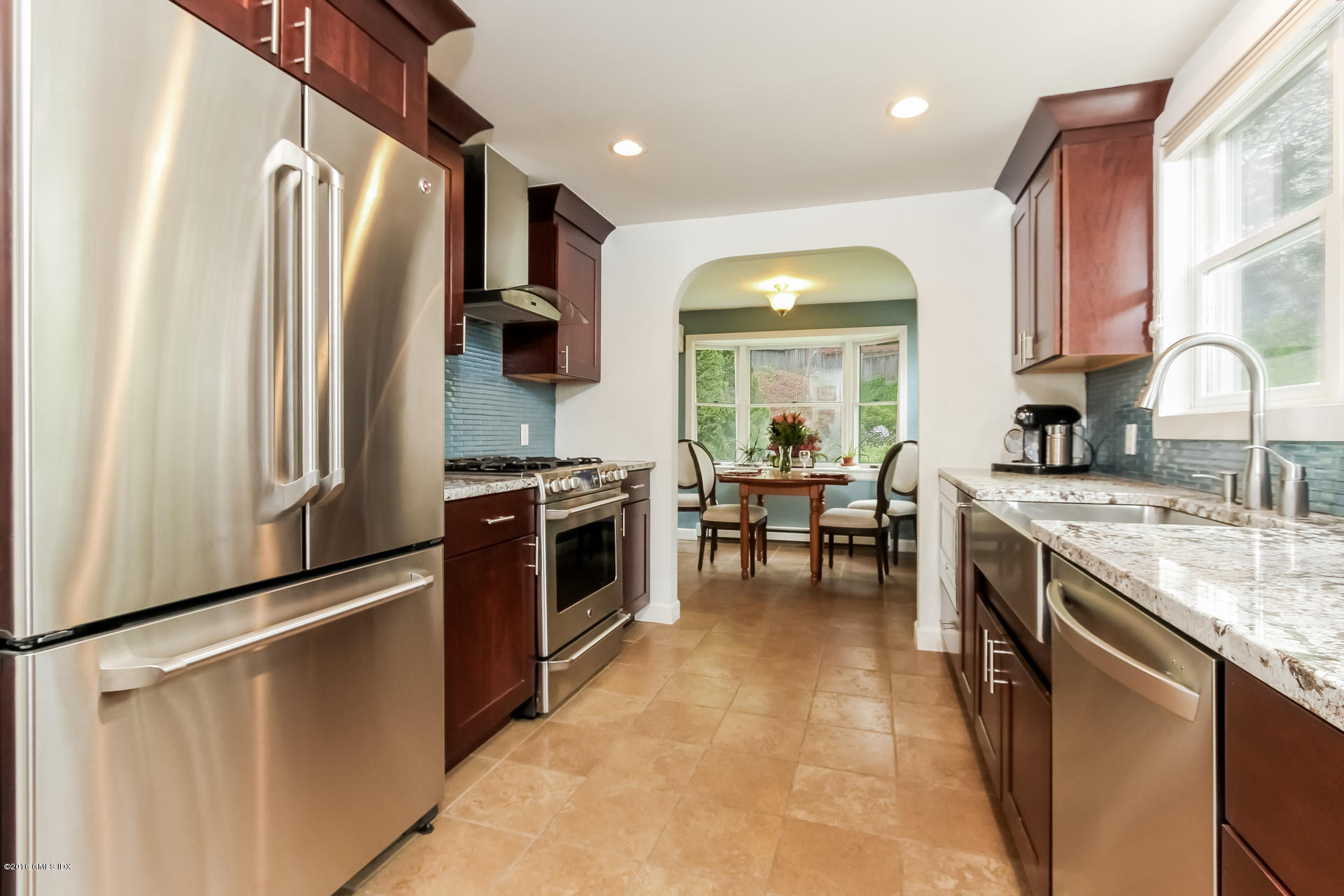 3 Idlewild Manor Greenwich, CT 06830 - Photo 5 of 26 a kitchen with stainless steel appliances granite countertop a refrigerator a stove a sink and a microwave