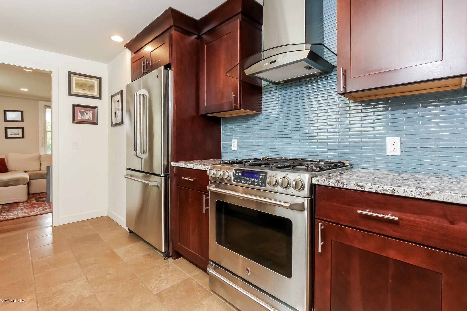 3 Idlewild Manor Greenwich, CT 06830 - Photo 6 of 26 a kitchen with stainless steel appliances granite countertop a stove and a refrigerator