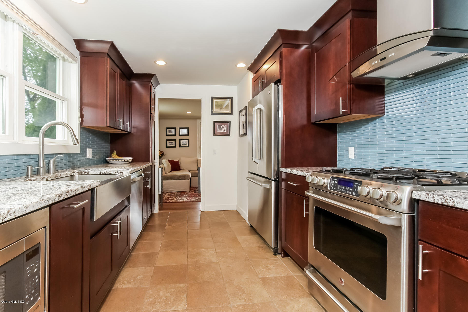 3 Idlewild Manor Greenwich, CT 06830 - Photo 7 of 26 a kitchen with stainless steel appliances granite countertop a stove top oven a sink and a refrigerator