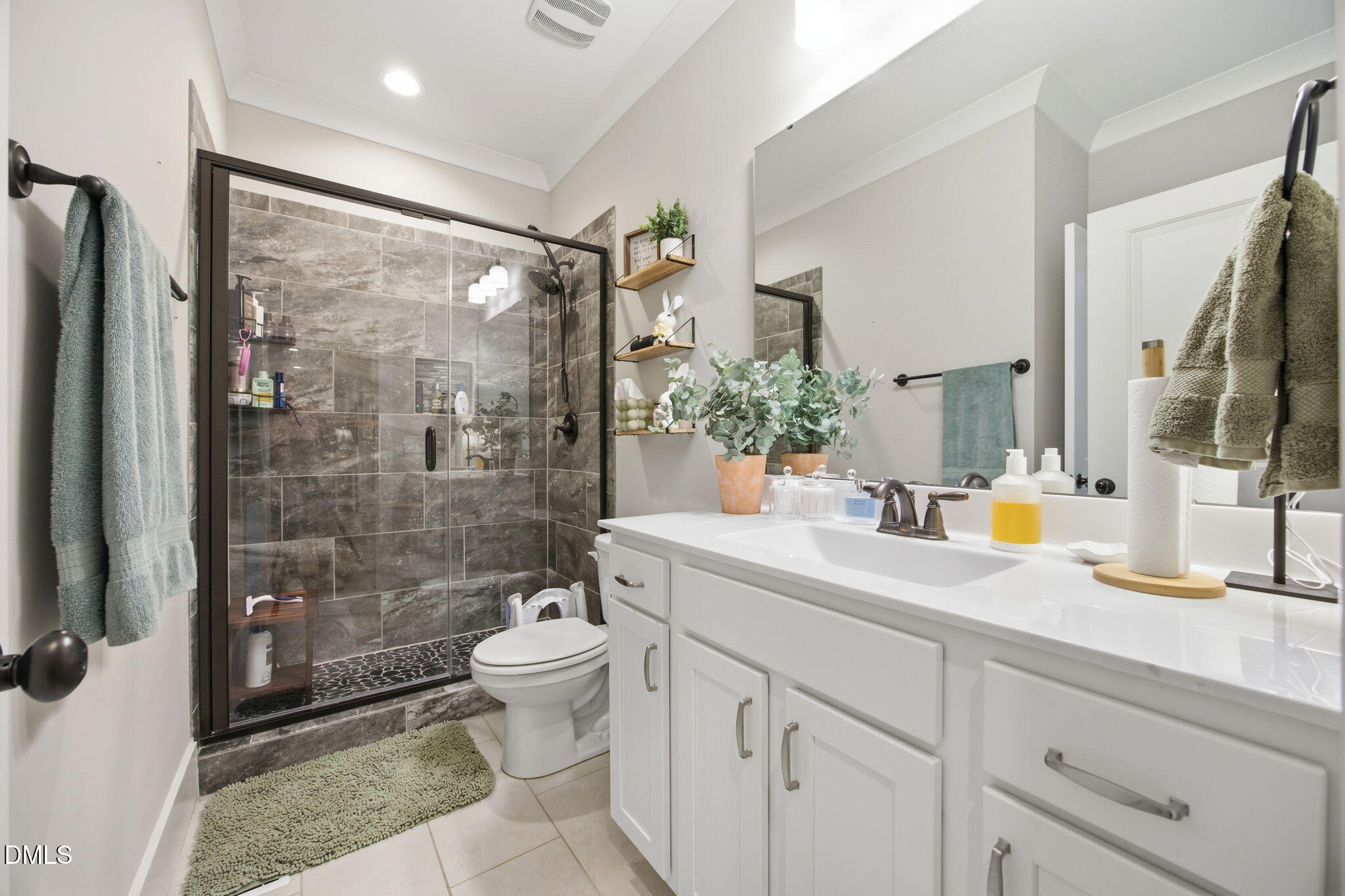 3511 Bruce Garner Road Wake Forest, NC 27587 - Photo 27 of 56 a bathroom with a granite countertop sink toilet and shower