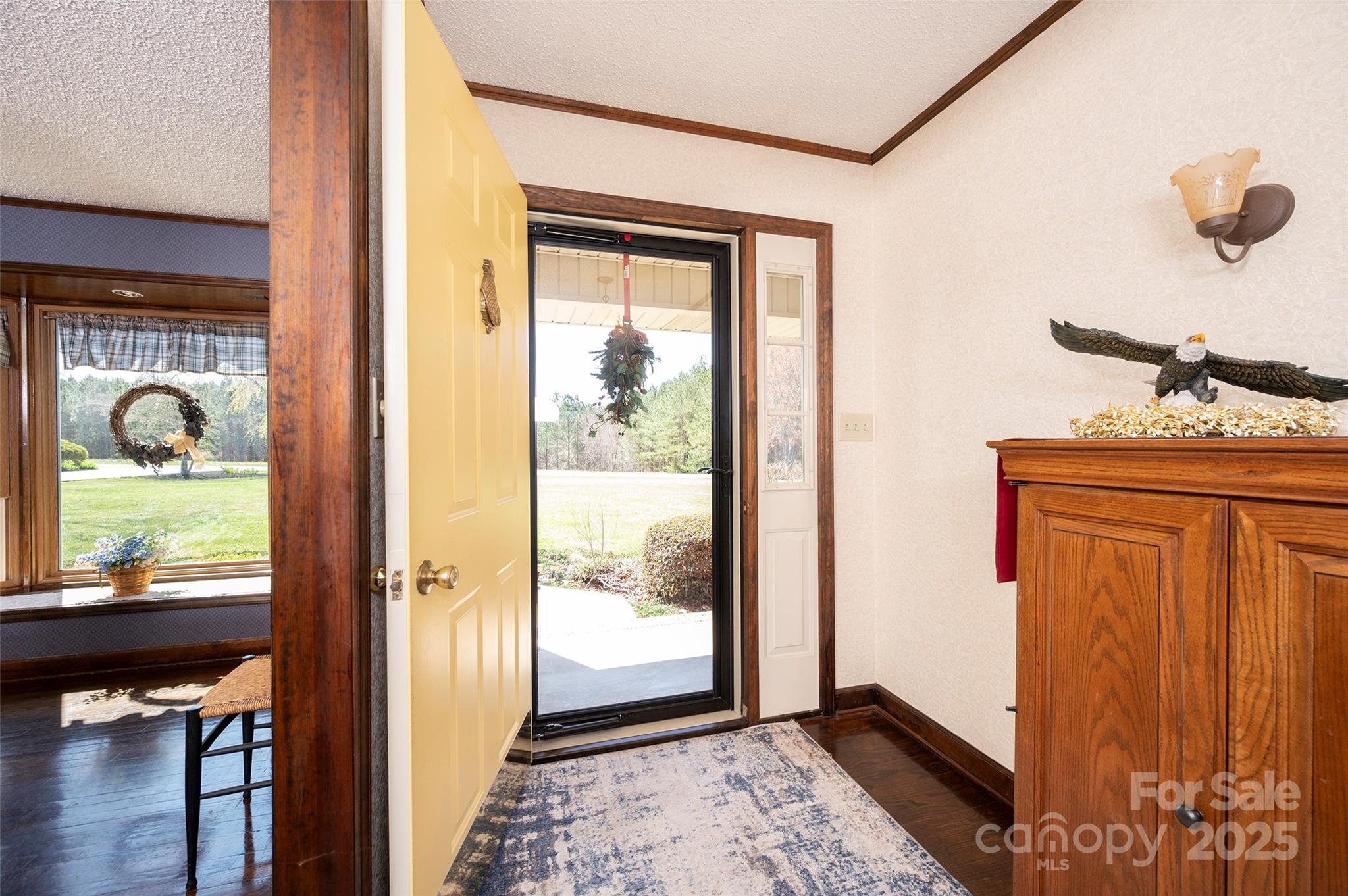 1120 Fred Merritt Road King, NC 27021 - Photo 18 of 45 a view of a hallway with a door and wooden floor