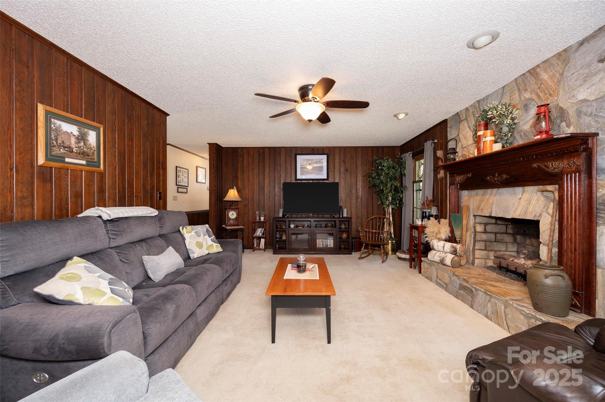 1120 Fred Merritt Road King, NC 27021 - Photo 20 of 45 a living room with furniture and a fireplace