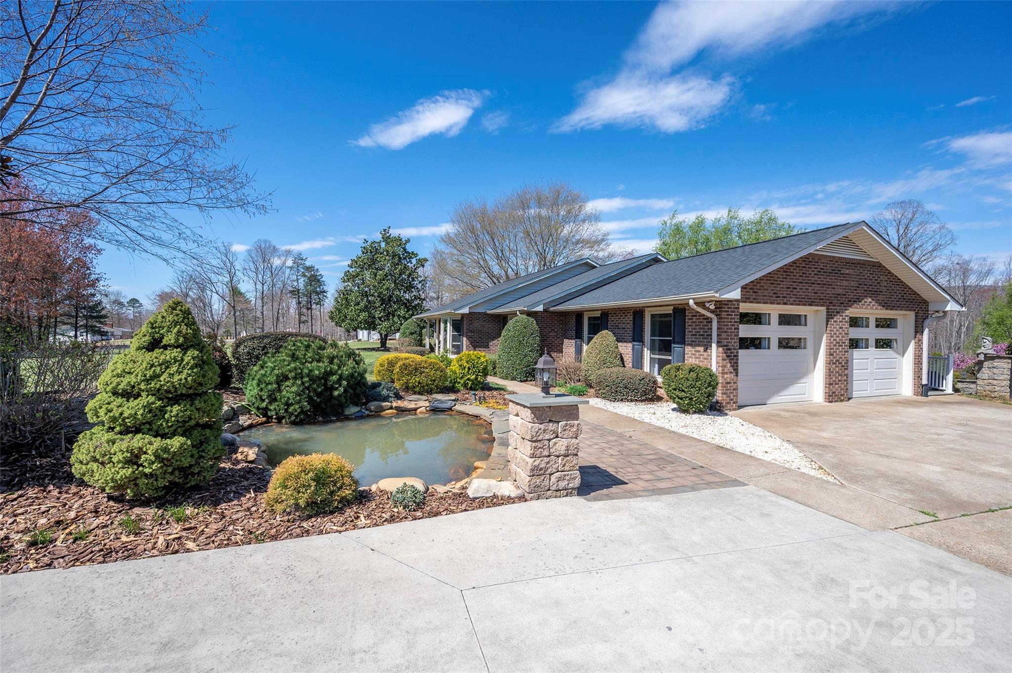 1120 Fred Merritt Road King, NC 27021 - Photo 2 of 45 a view of a house with garden and sitting area