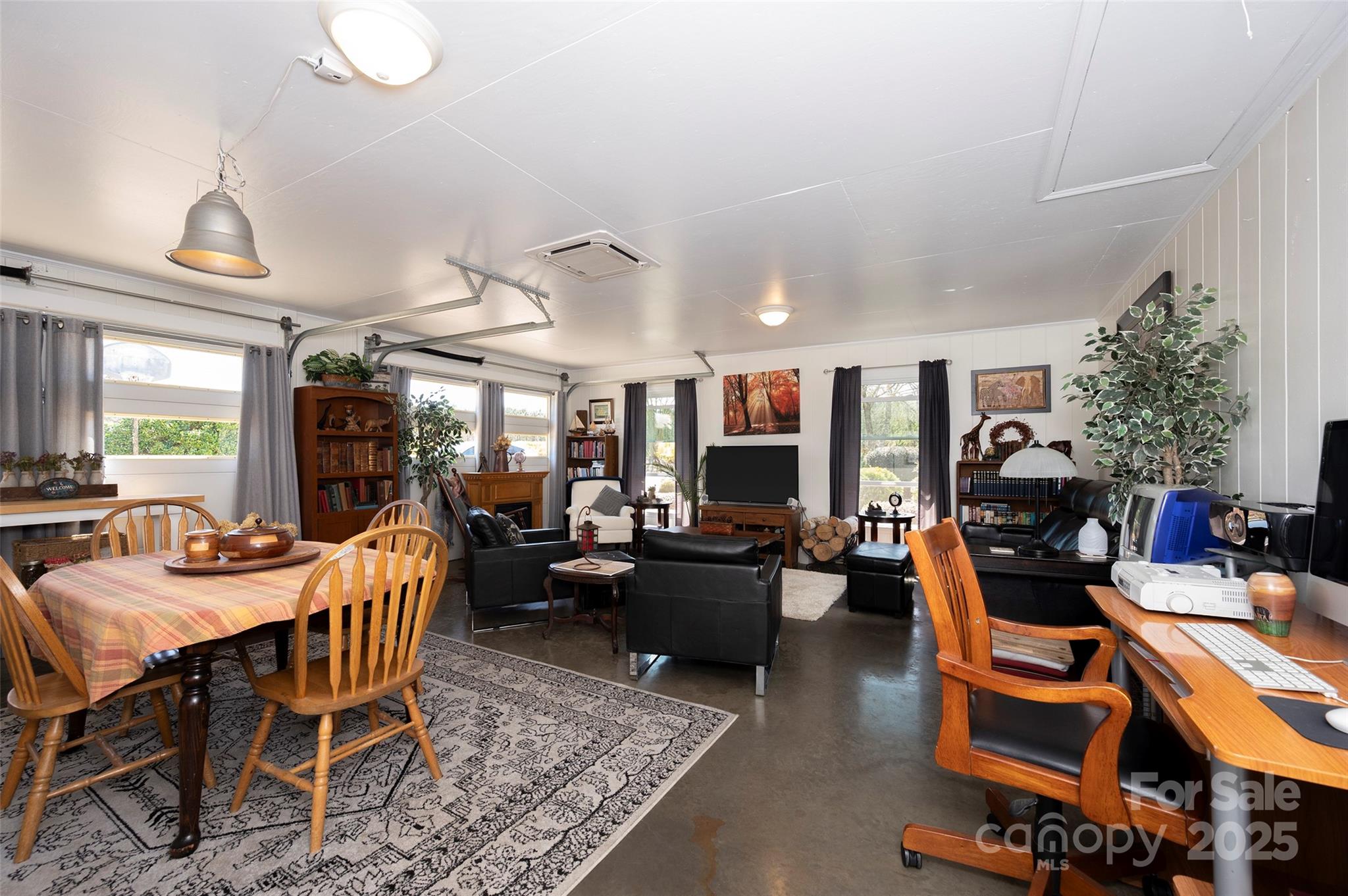 1120 Fred Merritt Road King, NC 27021 - Photo 22 of 45 a living room with furniture kitchen view and a large window