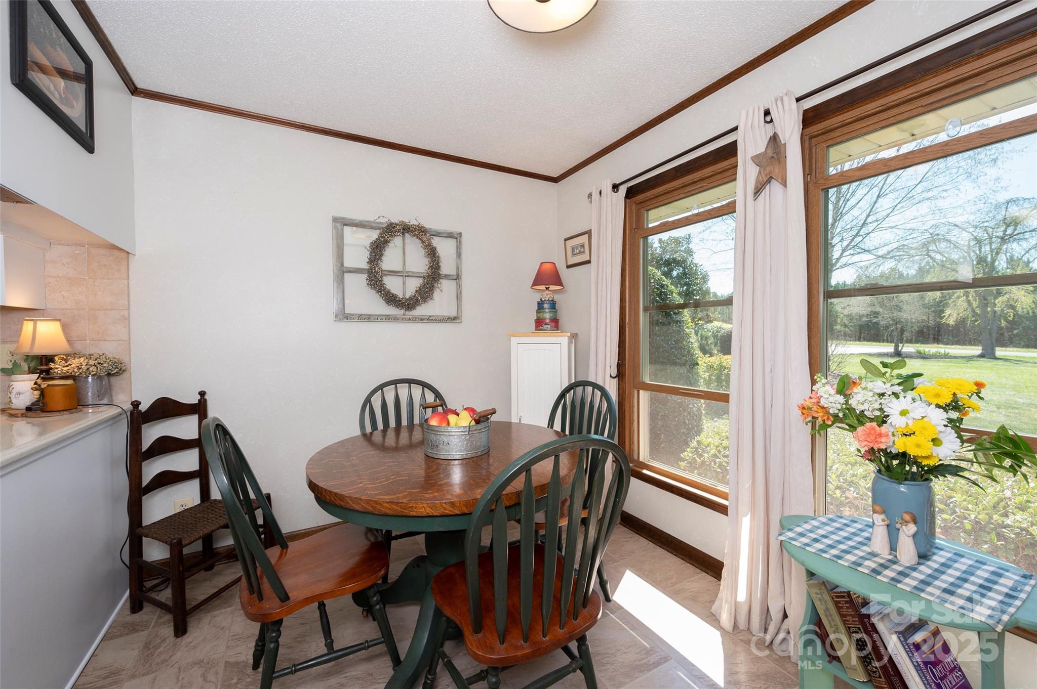 1120 Fred Merritt Road King, NC 27021 - Photo 25 of 45 a view of a dining room with furniture wooden floor and a window
