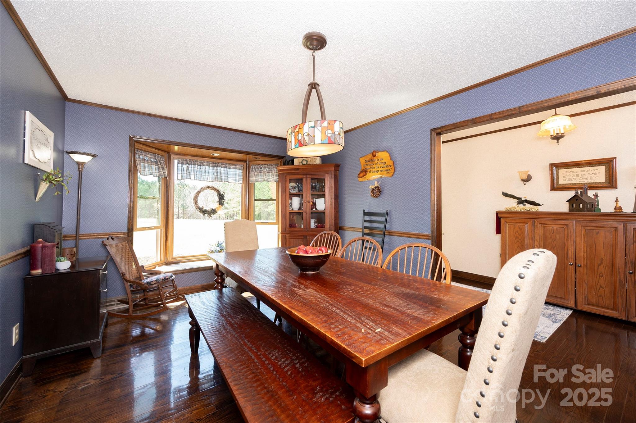 1120 Fred Merritt Road King, NC 27021 - Photo 26 of 45 a view of a dining room with furniture window and wooden floor