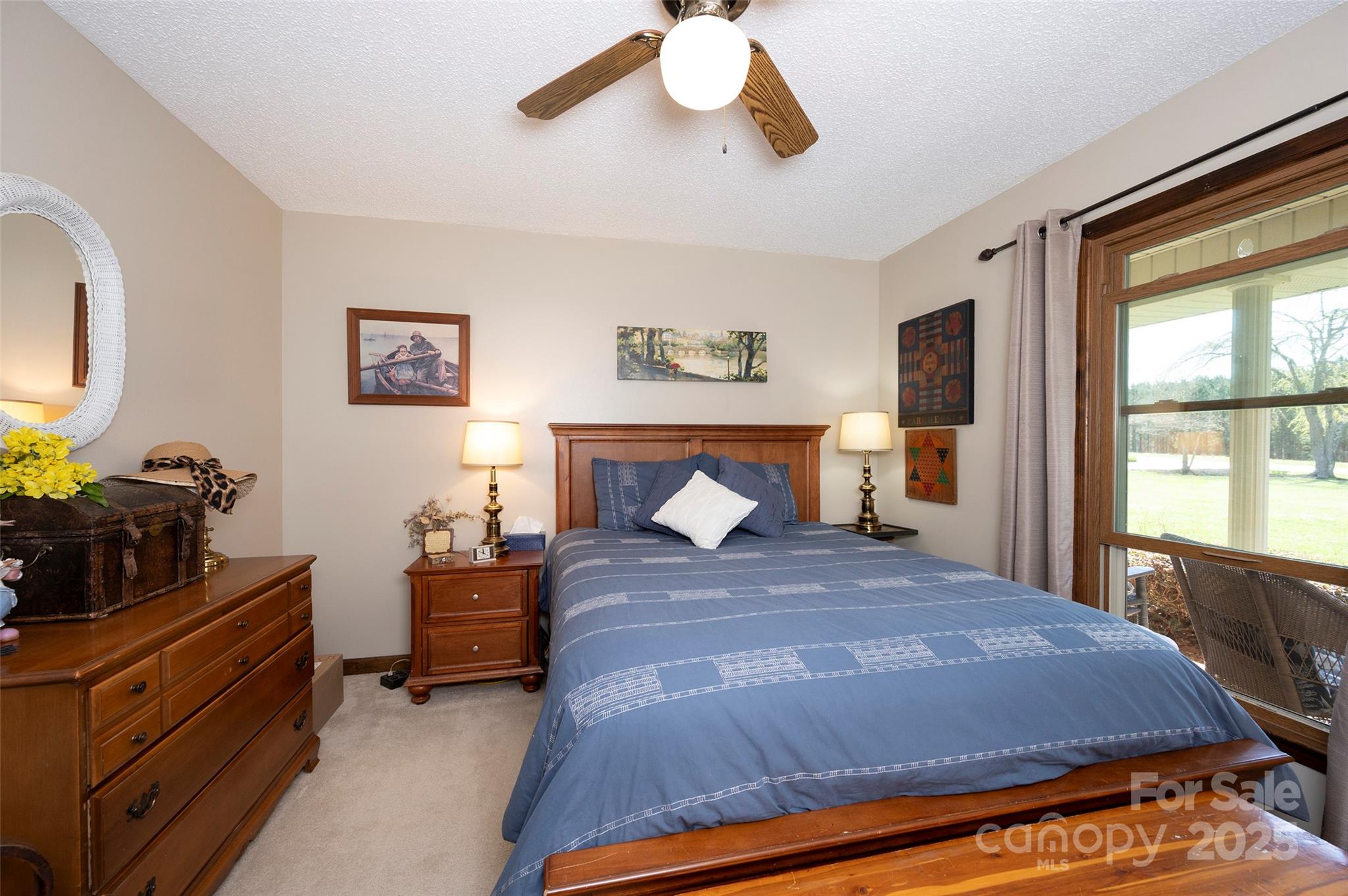 1120 Fred Merritt Road King, NC 27021 - Photo 30 of 45 a bedroom with a bed and wooden floor