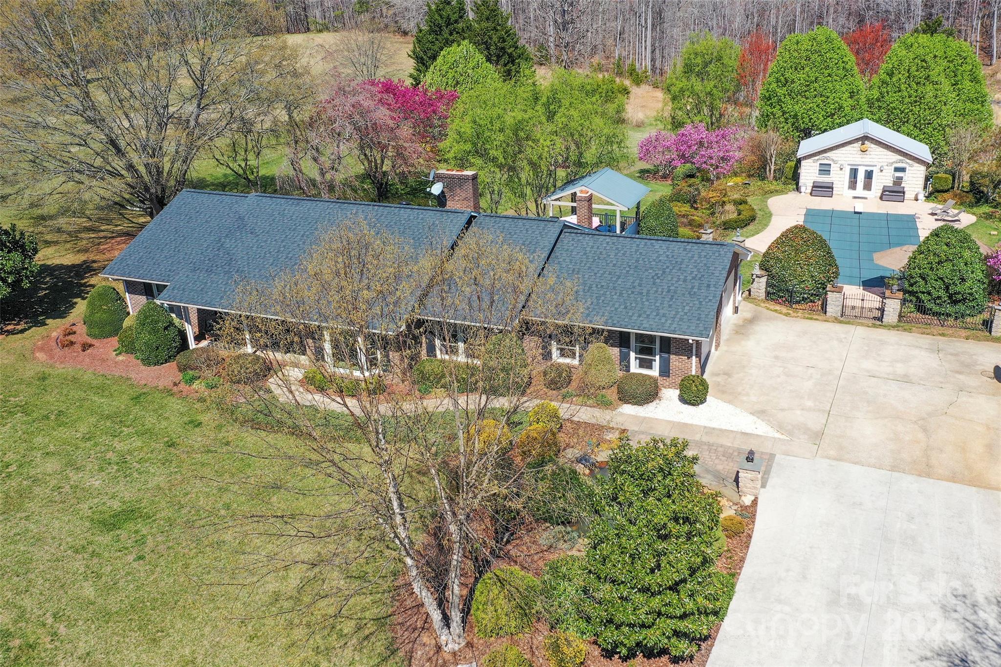 1120 Fred Merritt Road King, NC 27021 - Photo 4 of 45 an aerial view of a house with a yard and a large tree