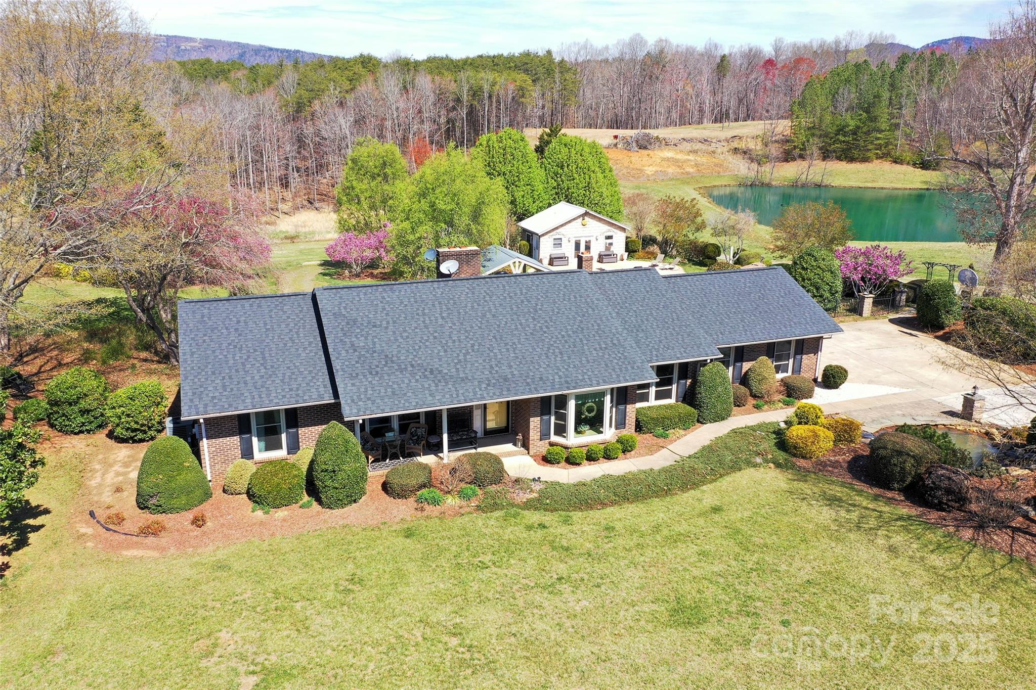 1120 Fred Merritt Road King, NC 27021 - Photo 5 of 45 a view of a house with pool and a yard