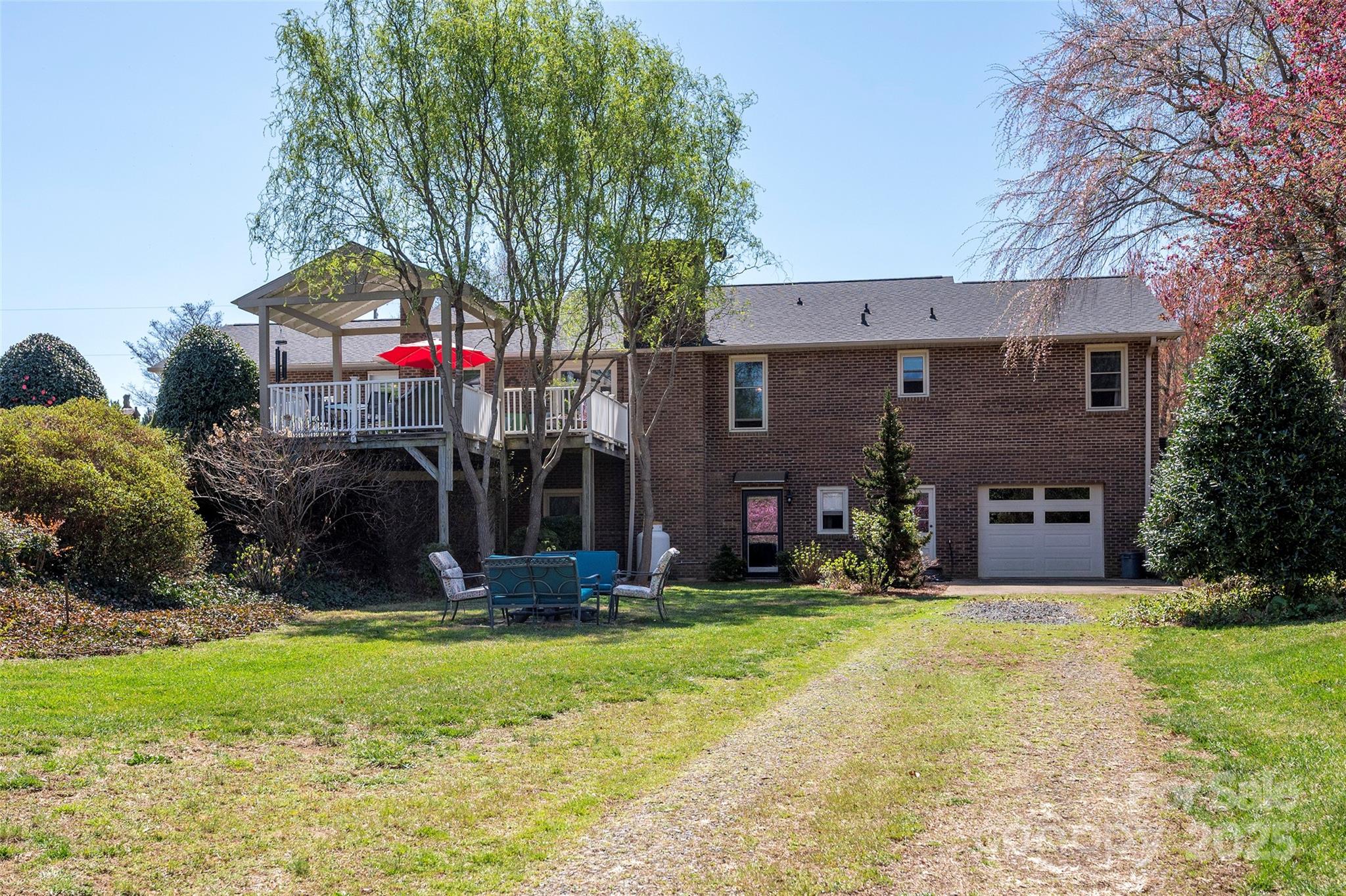1120 Fred Merritt Road King, NC 27021 - Photo 9 of 45 a view of a house with a yard and tree