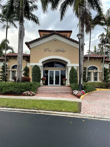 a front view of a house with a garden and a yard