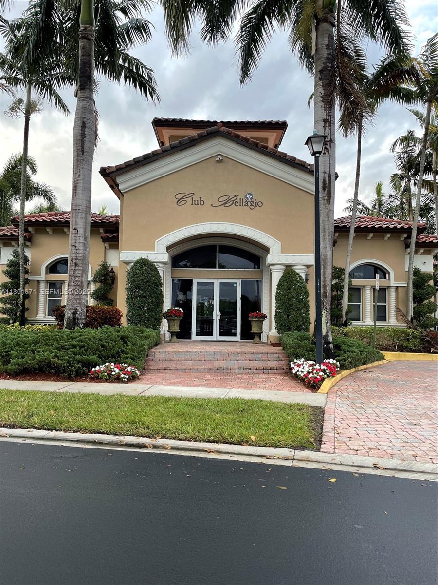 12708 Southwest 49th Drive Miramar, FL 33027 - Photo 4 of 16 a front view of a house with a garden and a yard