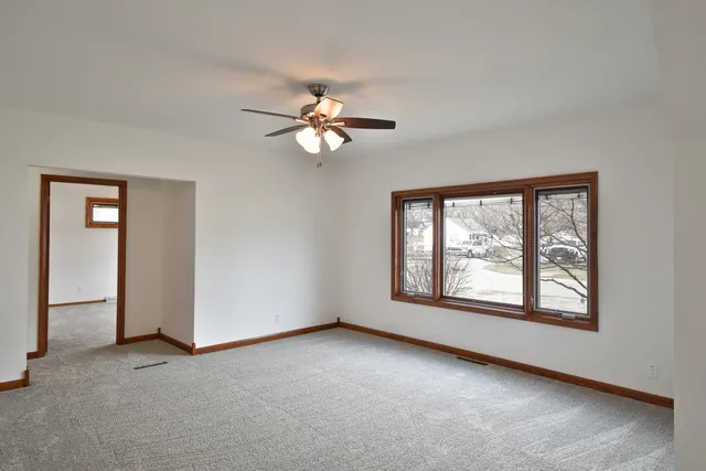 a view of empty room with windows