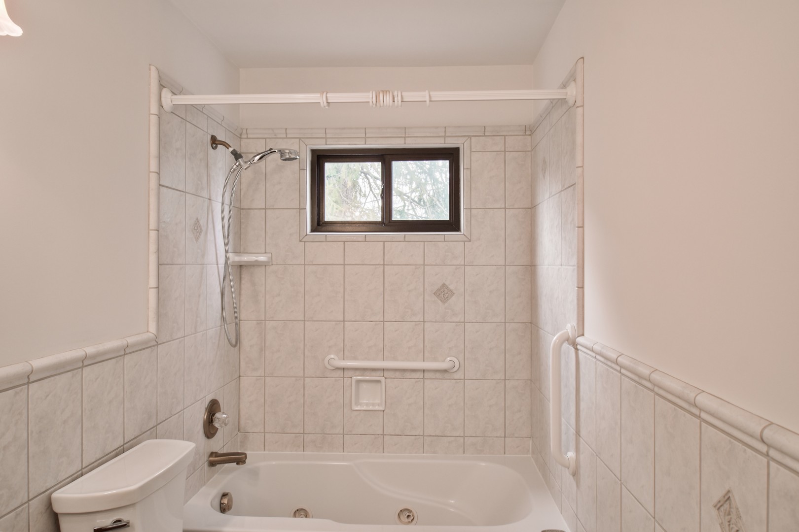 301 East Douglas Street St. Joseph, IL 61873 - Photo 20 of 38 a bathroom with a bathtub and a sink