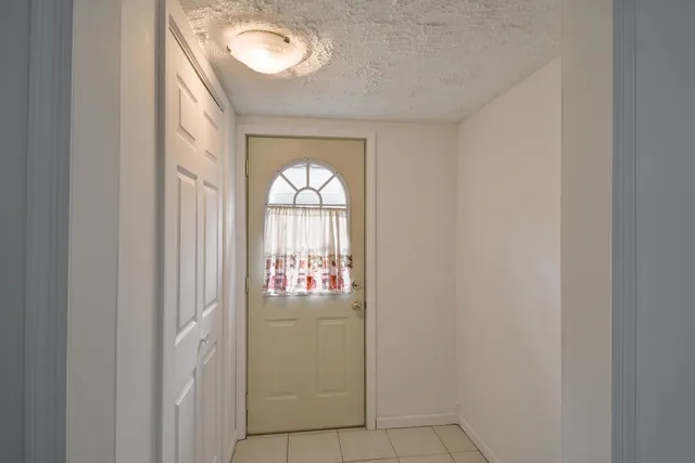 a view of entryway with wooden floor