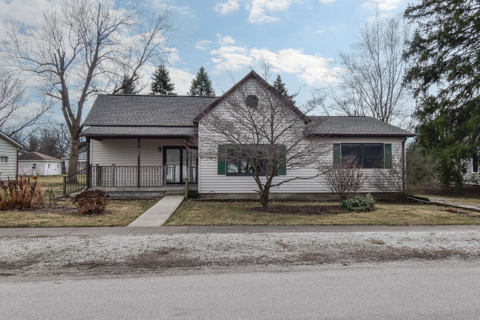 301 East Douglas Street St. Joseph, IL 61873 - Photo 3 of 38 a front view of a house with a yard