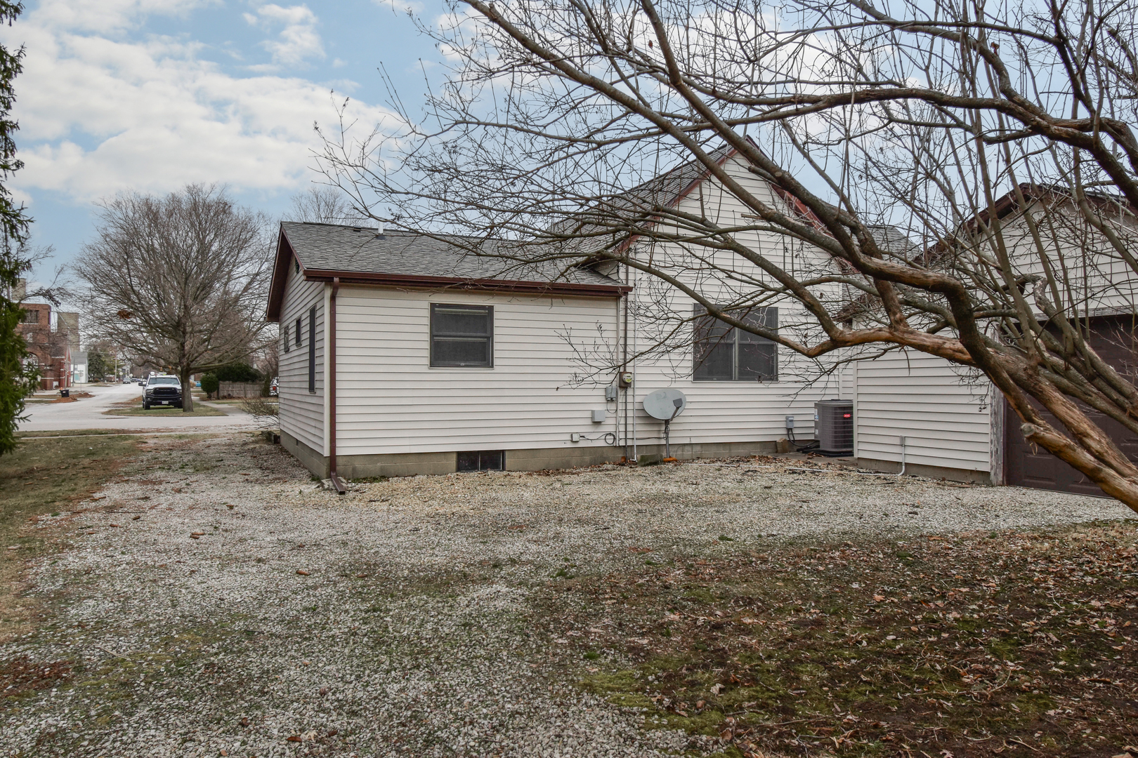 301 East Douglas Street St. Joseph, IL 61873 - Photo 31 of 38 a house with trees in the background
