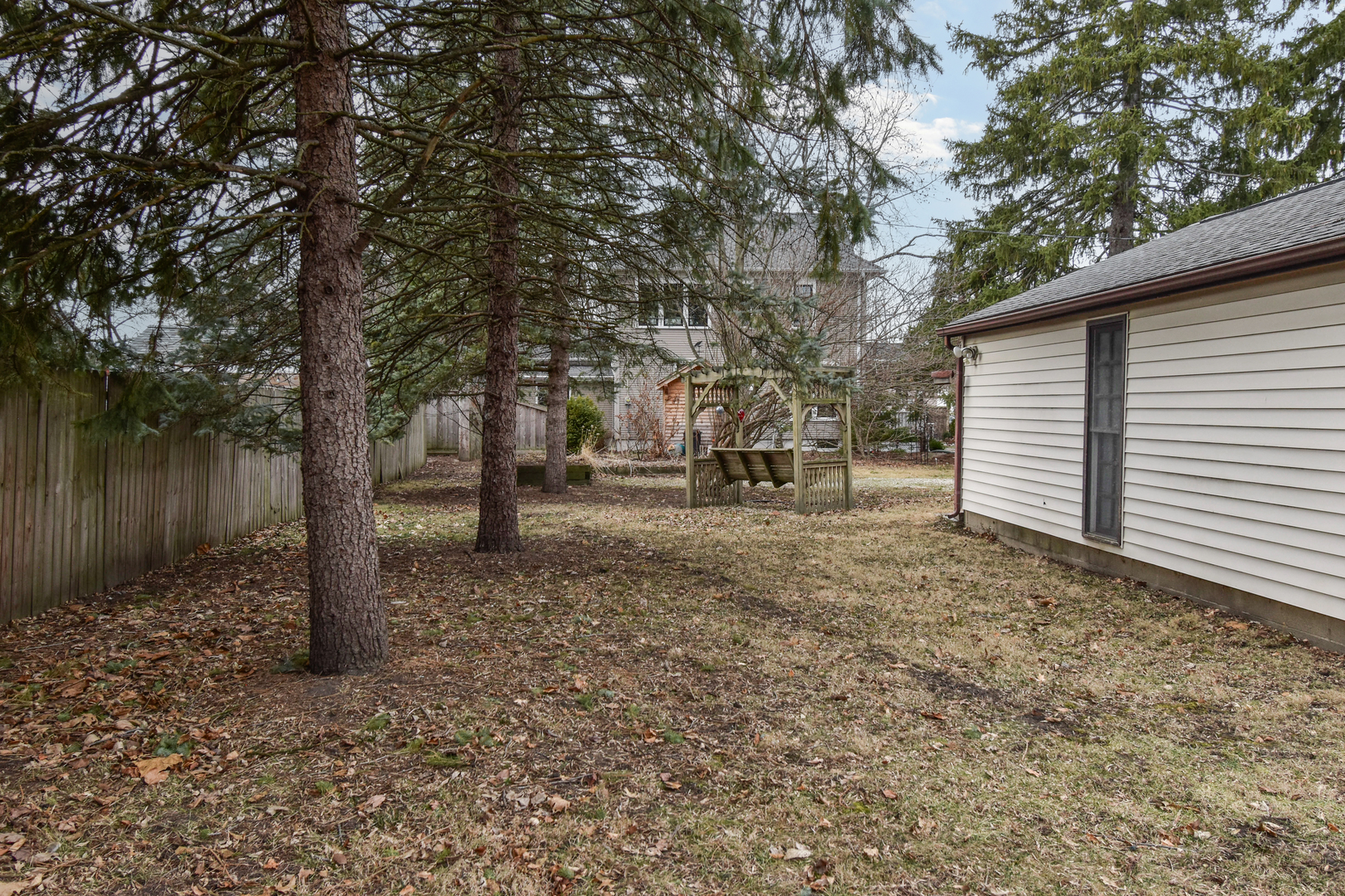 301 East Douglas Street St. Joseph, IL 61873 - Photo 34 of 38 a backyard of a house with lots of green space
