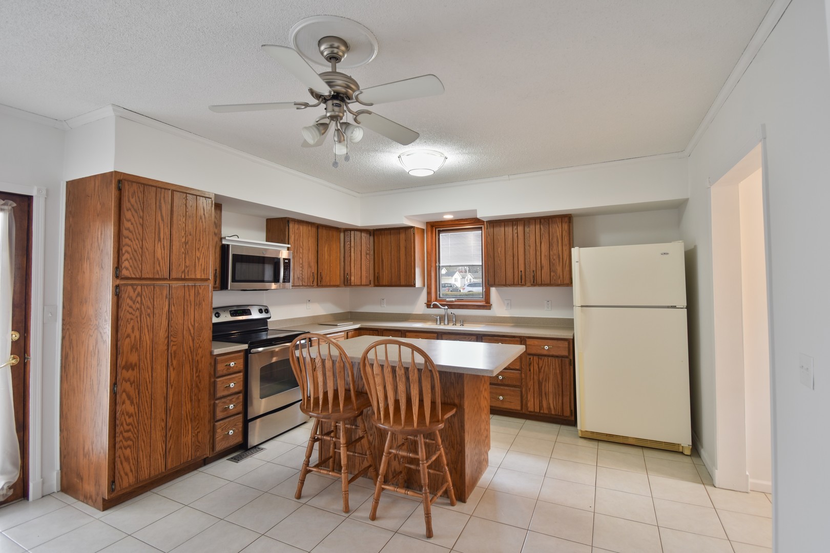 301 East Douglas Street St. Joseph, IL 61873 - Photo 6 of 38 a kitchen with stainless steel appliances a refrigerator a stove a sink and dishwasher
