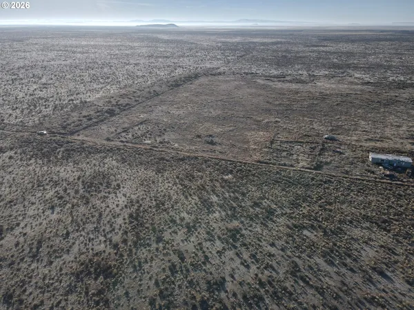 a view of a dry yard with wooden floor