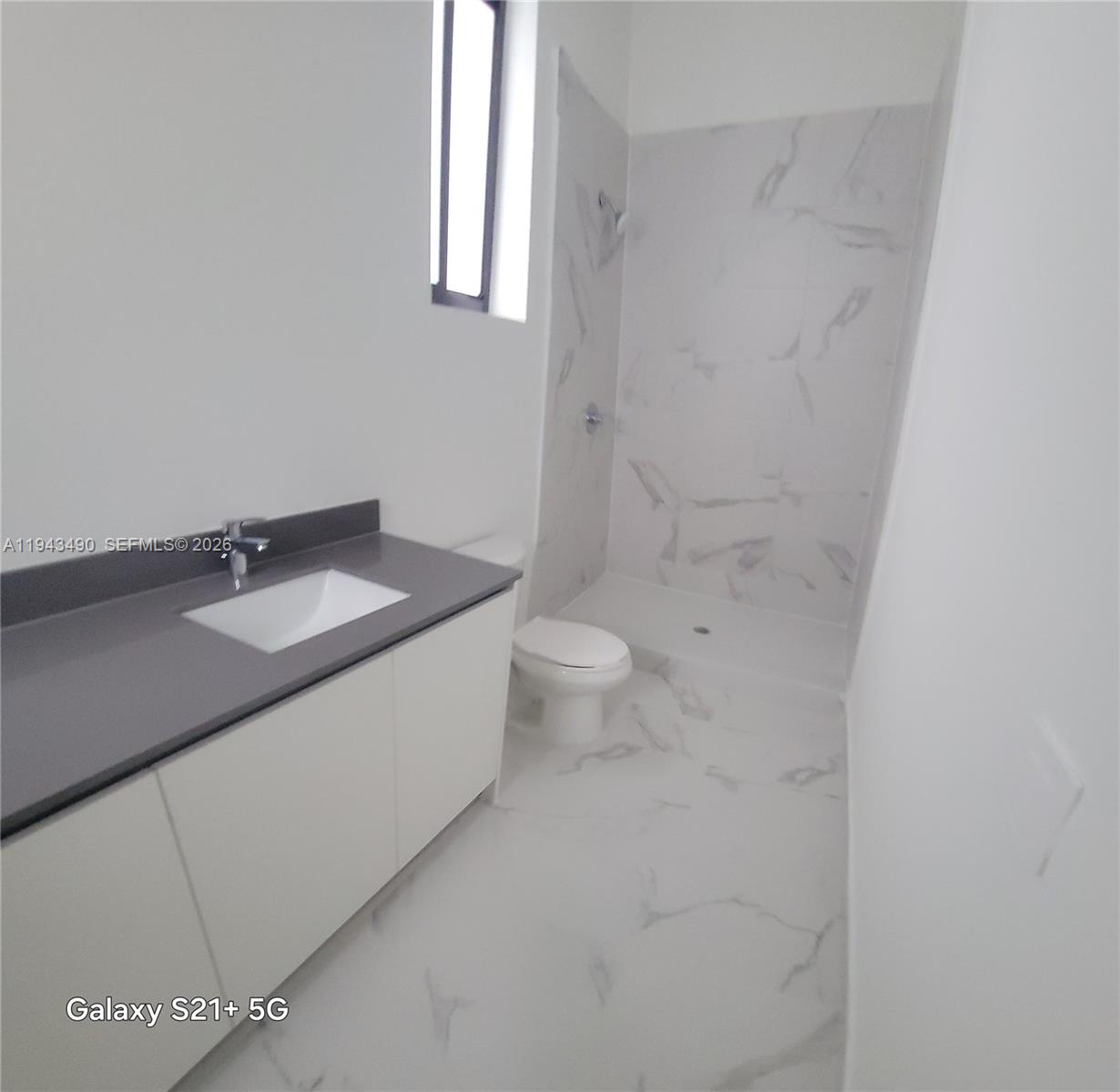 34493 Southwest 191st Court Homestead, FL 33034 - Photo 11 of 12 a bathroom with a sink toilet and vanity