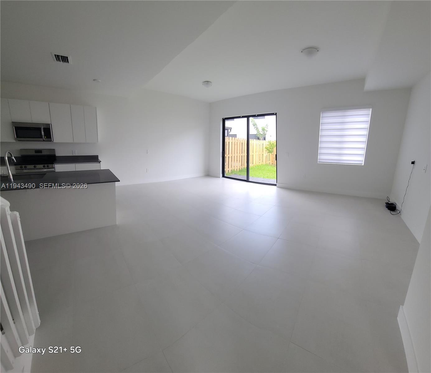 34493 Southwest 191st Court Homestead, FL 33034 - Photo 2 of 12 a view of an empty room with a window
