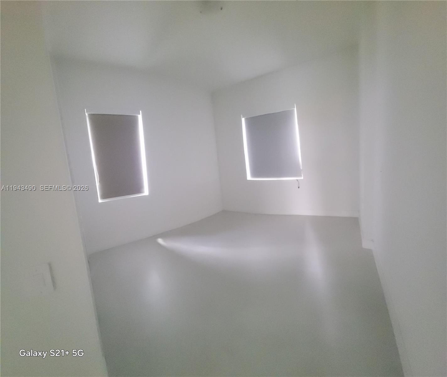 34493 Southwest 191st Court Homestead, FL 33034 - Photo 9 of 12 an empty room with a window