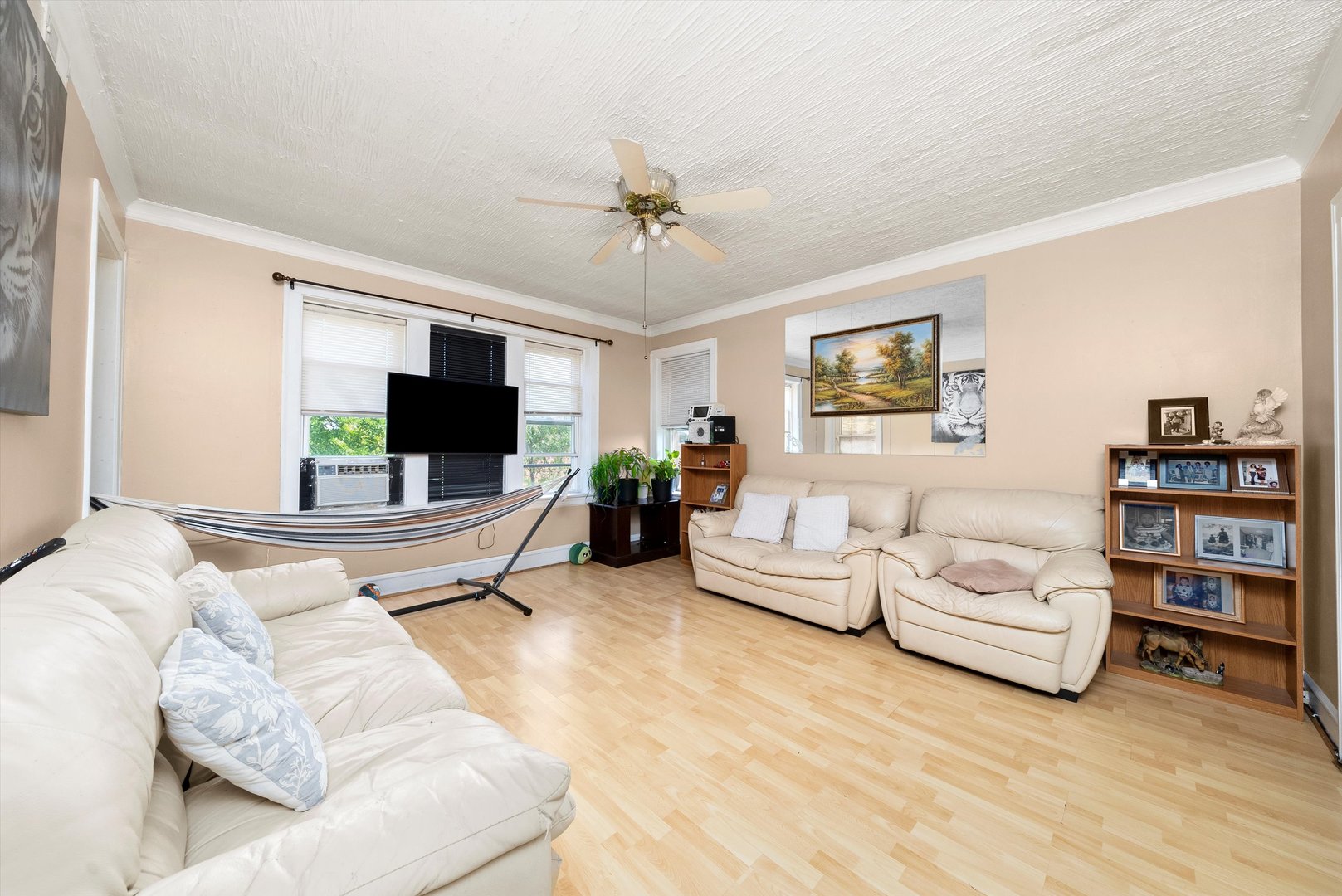 4629 West Parker Avenue Chicago, IL 60639 - Photo 12 of 29 a living room with furniture and a flat screen tv