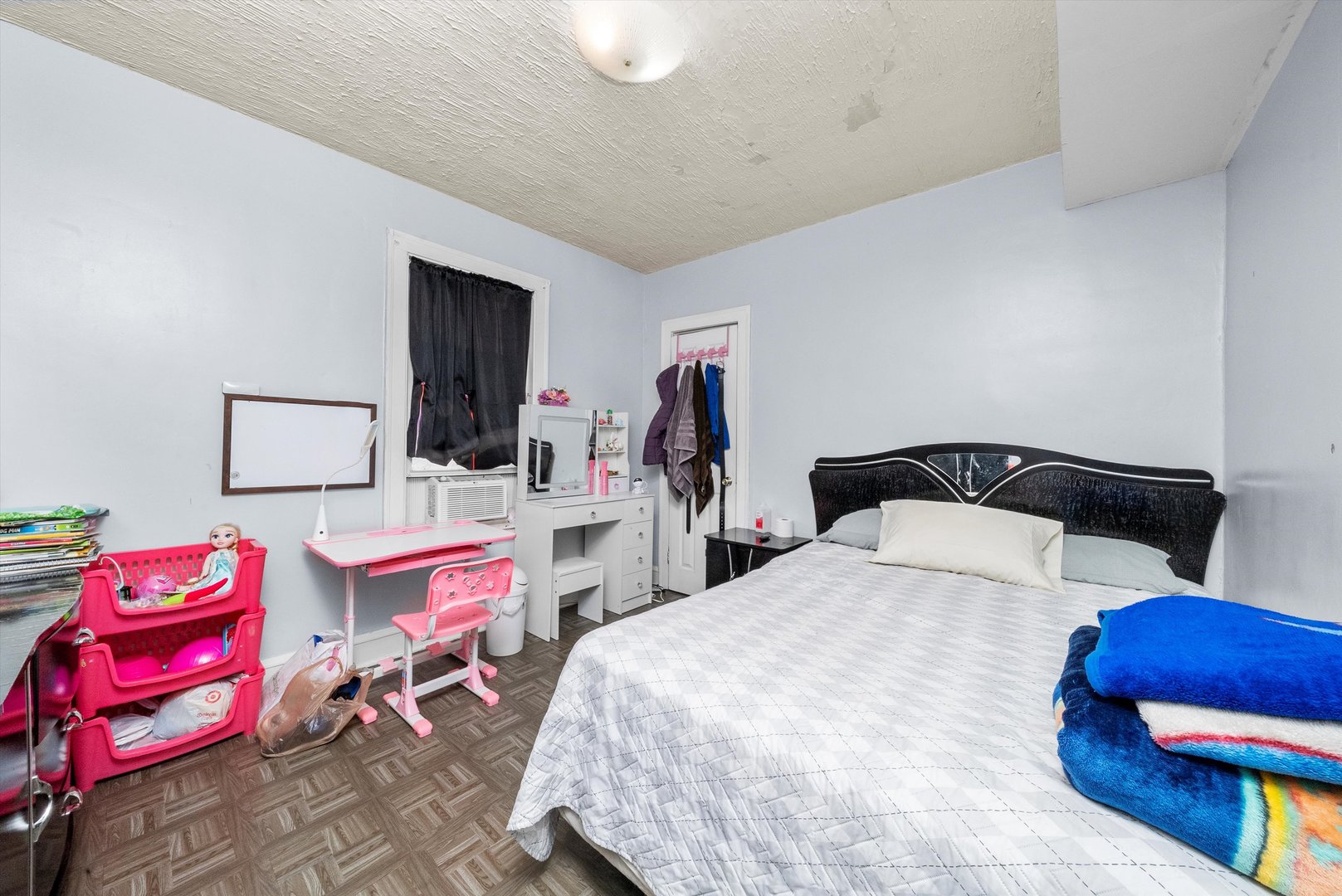 4629 West Parker Avenue Chicago, IL 60639 - Photo 14 of 29 a bedroom with a bed and dresser