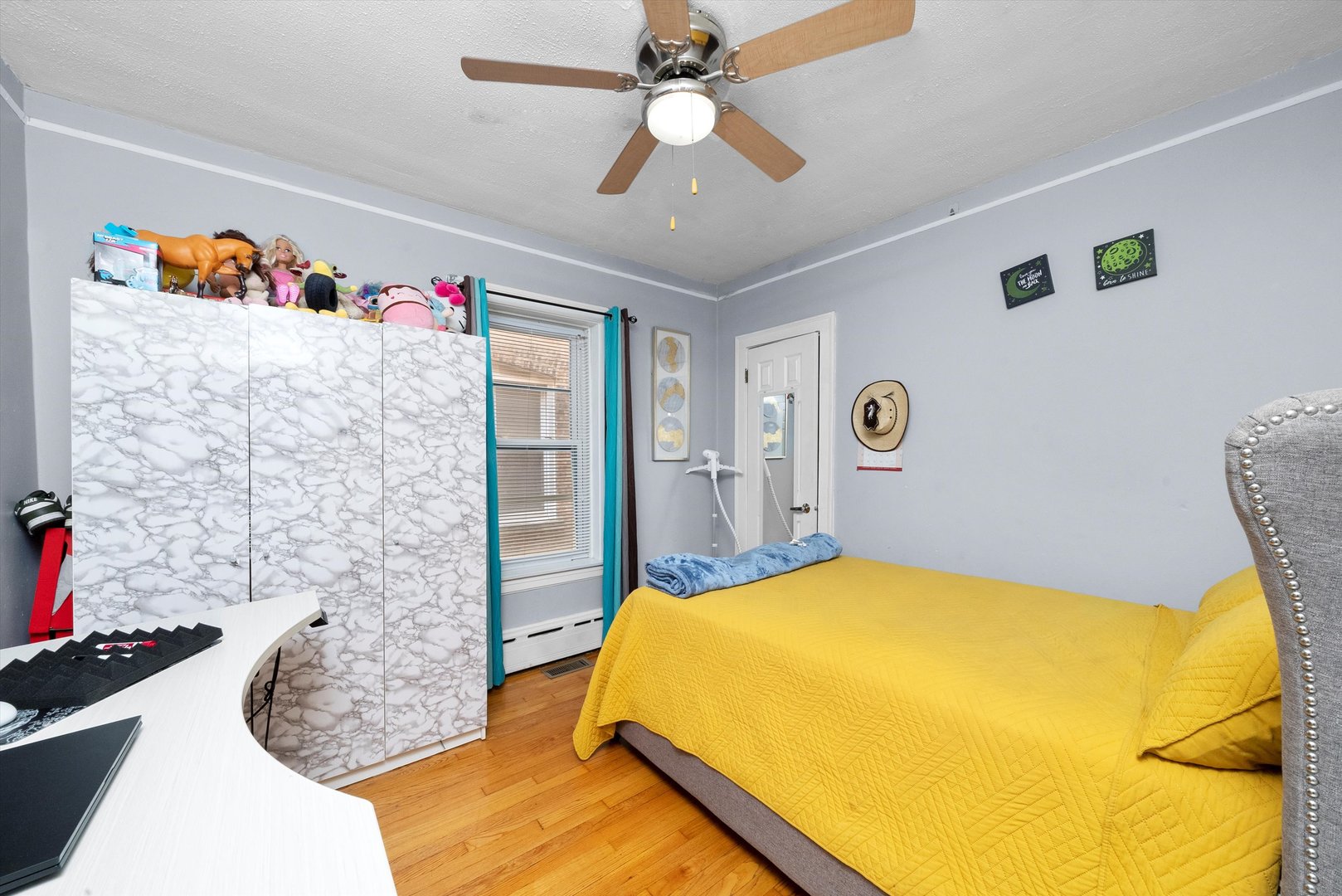 4629 West Parker Avenue Chicago, IL 60639 - Photo 5 of 29 a bedroom with a bed and a chandelier