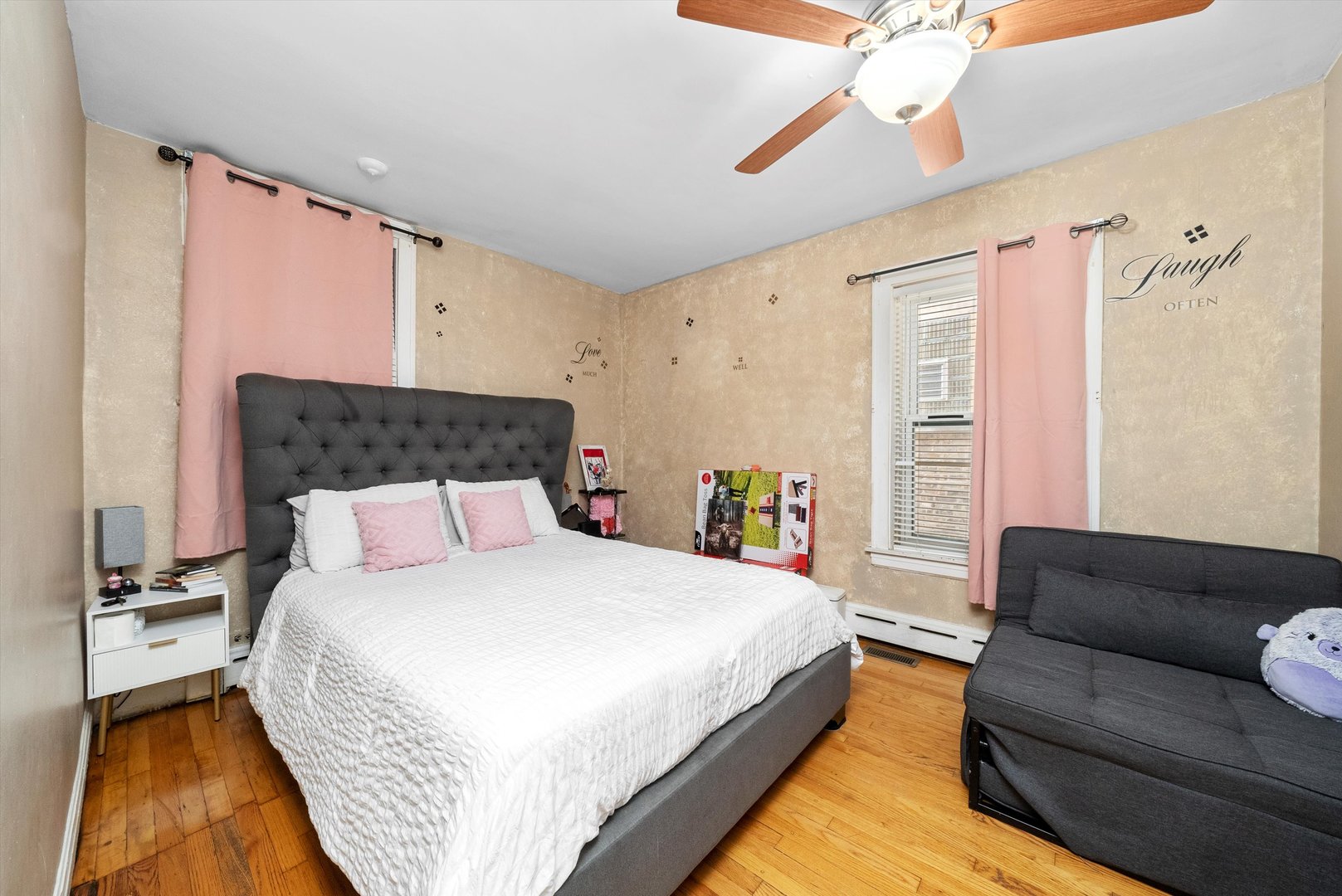 4629 West Parker Avenue Chicago, IL 60639 - Photo 6 of 29 a spacious bedroom with a bed couch and a window