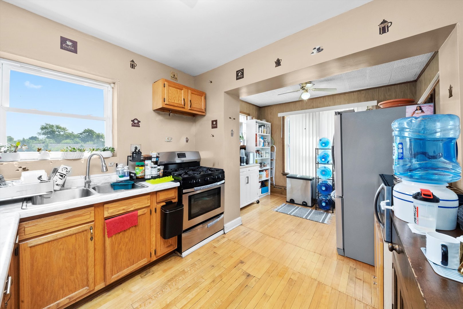 4629 West Parker Avenue Chicago, IL 60639 - Photo 8 of 29 a kitchen with stainless steel appliances granite countertop a stove a sink dishwasher and a refrigerator