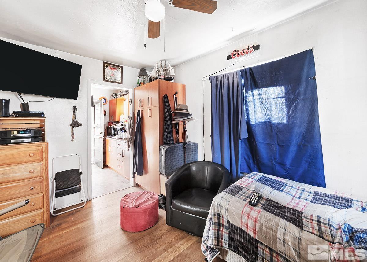 412 East 8th Street Reno, NV 89512 - Photo 24 of 40 a bedroom with furniture and a flat screen tv