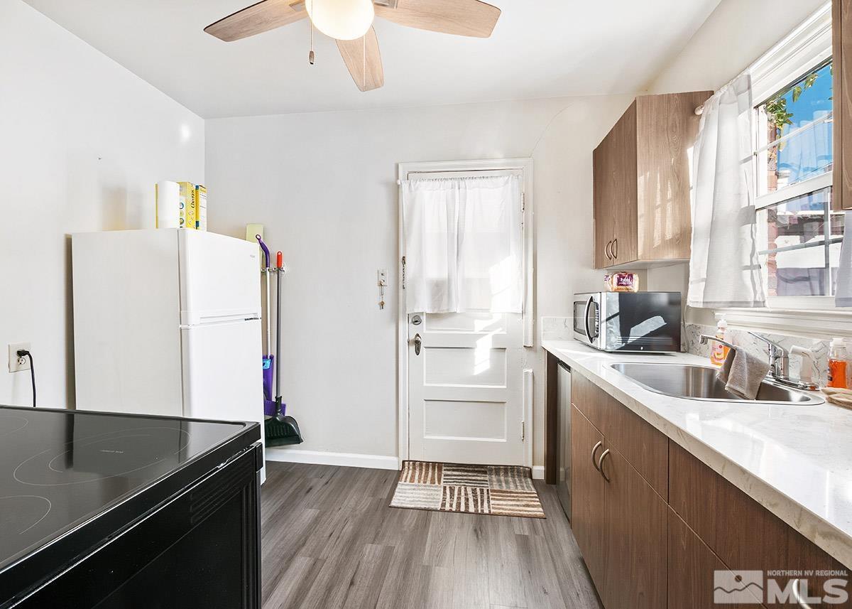 412 East 8th Street Reno, NV 89512 - Photo 32 of 40 a kitchen with a sink a refrigerator and window