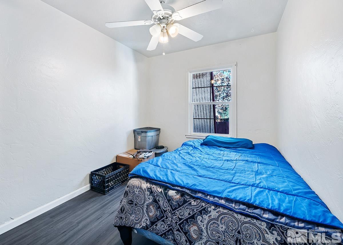412 East 8th Street Reno, NV 89512 - Photo 33 of 40 a bedroom with a bed and a bookshelf