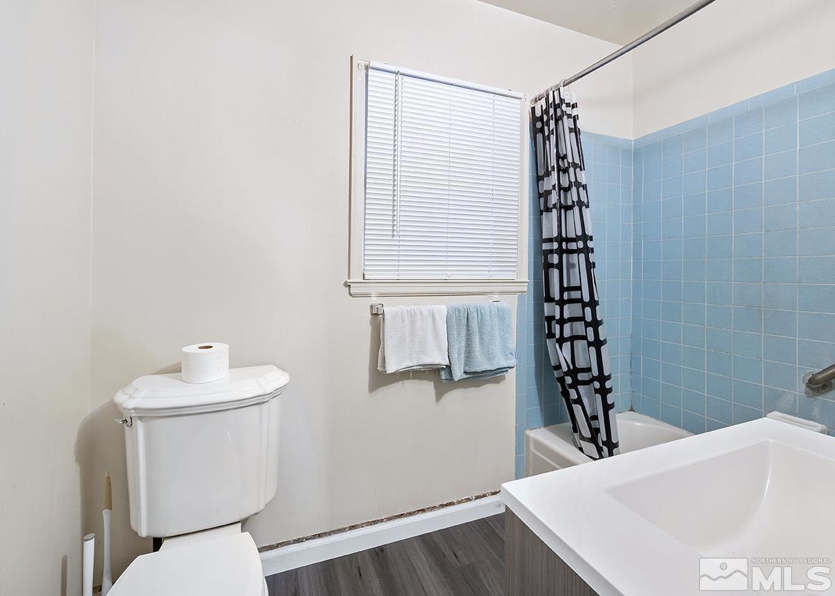 412 East 8th Street Reno, NV 89512 - Photo 34 of 40 a bathroom with a sink a toilet and shower