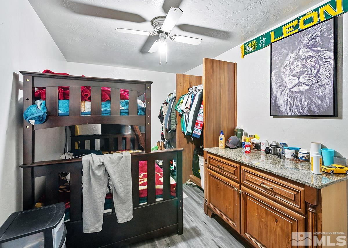412 East 8th Street Reno, NV 89512 - Photo 38 of 40 a room with furniture and a flat screen tv