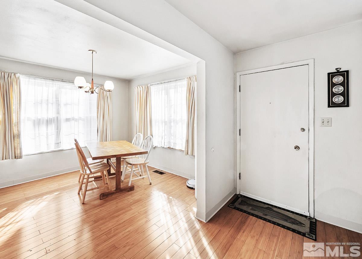 412 East 8th Street Reno, NV 89512 - Photo 4 of 40 a view of a dining room with furniture window and wooden floor