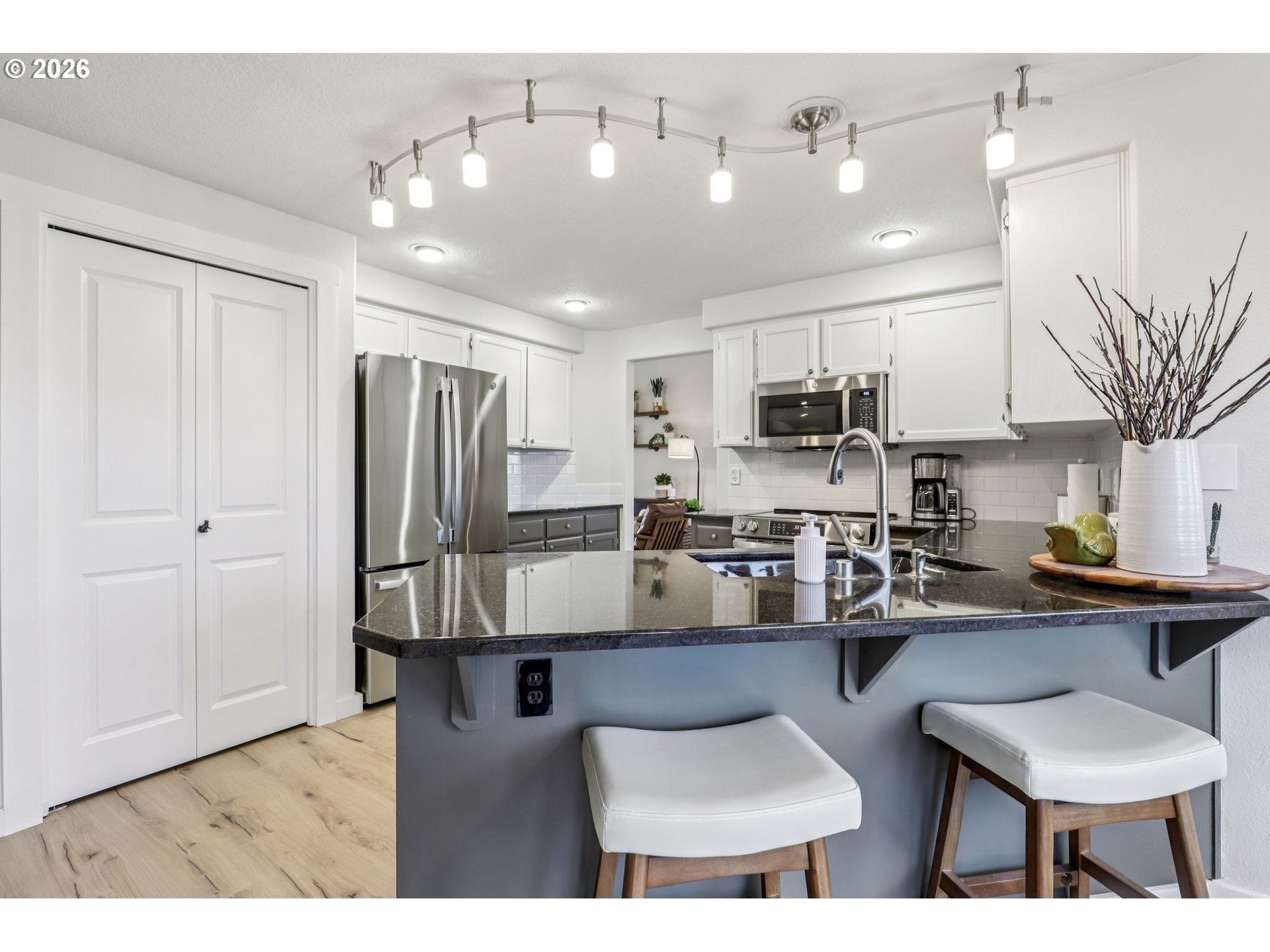 1702 Northeast 70th Street Vancouver, WA 98665 - Photo 16 of 32 a kitchen with refrigerator and cabinets