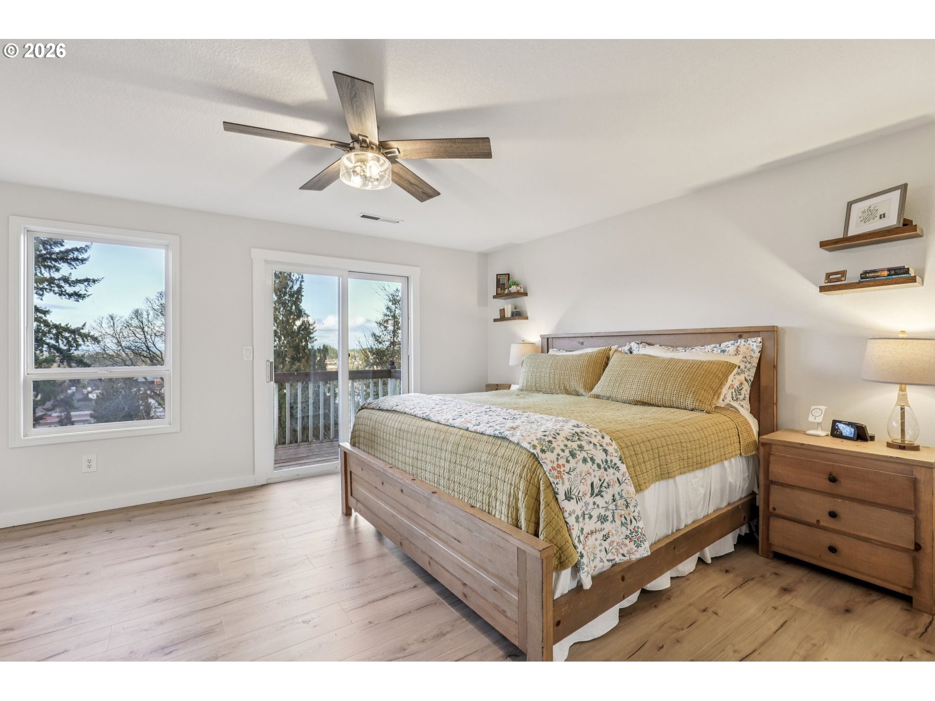 1702 Northeast 70th Street Vancouver, WA 98665 - Photo 22 of 32 a bedroom with a large bed and a chandelier