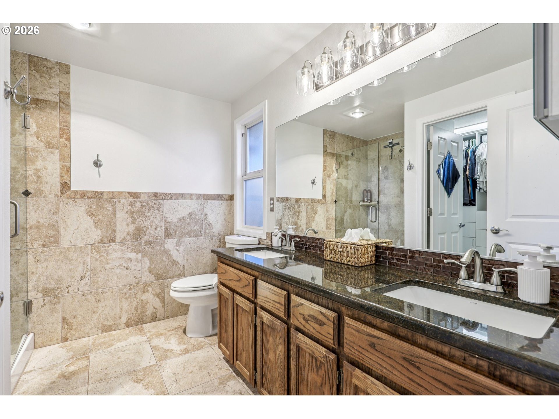 1702 Northeast 70th Street Vancouver, WA 98665 - Photo 25 of 32 a bathroom with a granite countertop sink a toilet and mirror