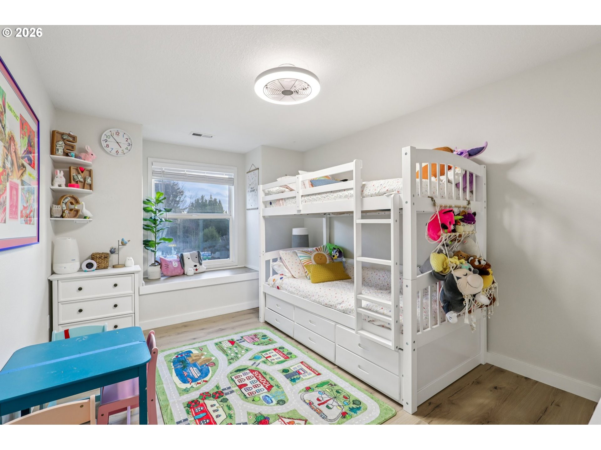 1702 Northeast 70th Street Vancouver, WA 98665 - Photo 26 of 32 a living room with furniture and a potted plant