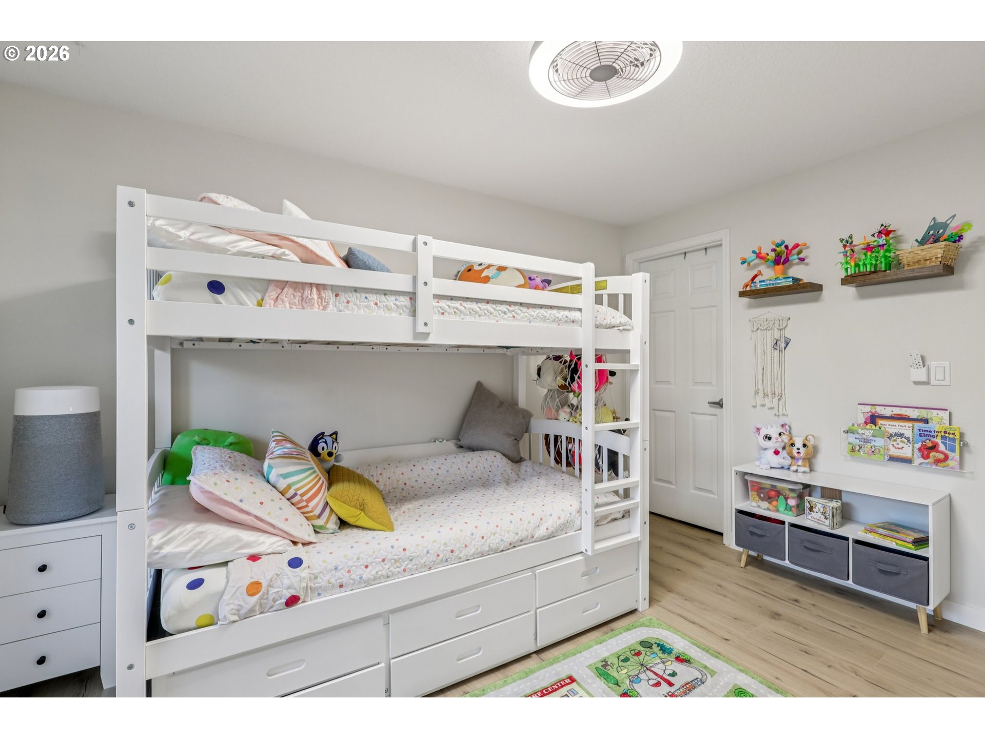 1702 Northeast 70th Street Vancouver, WA 98665 - Photo 27 of 32 a living room with furniture and a baby crib