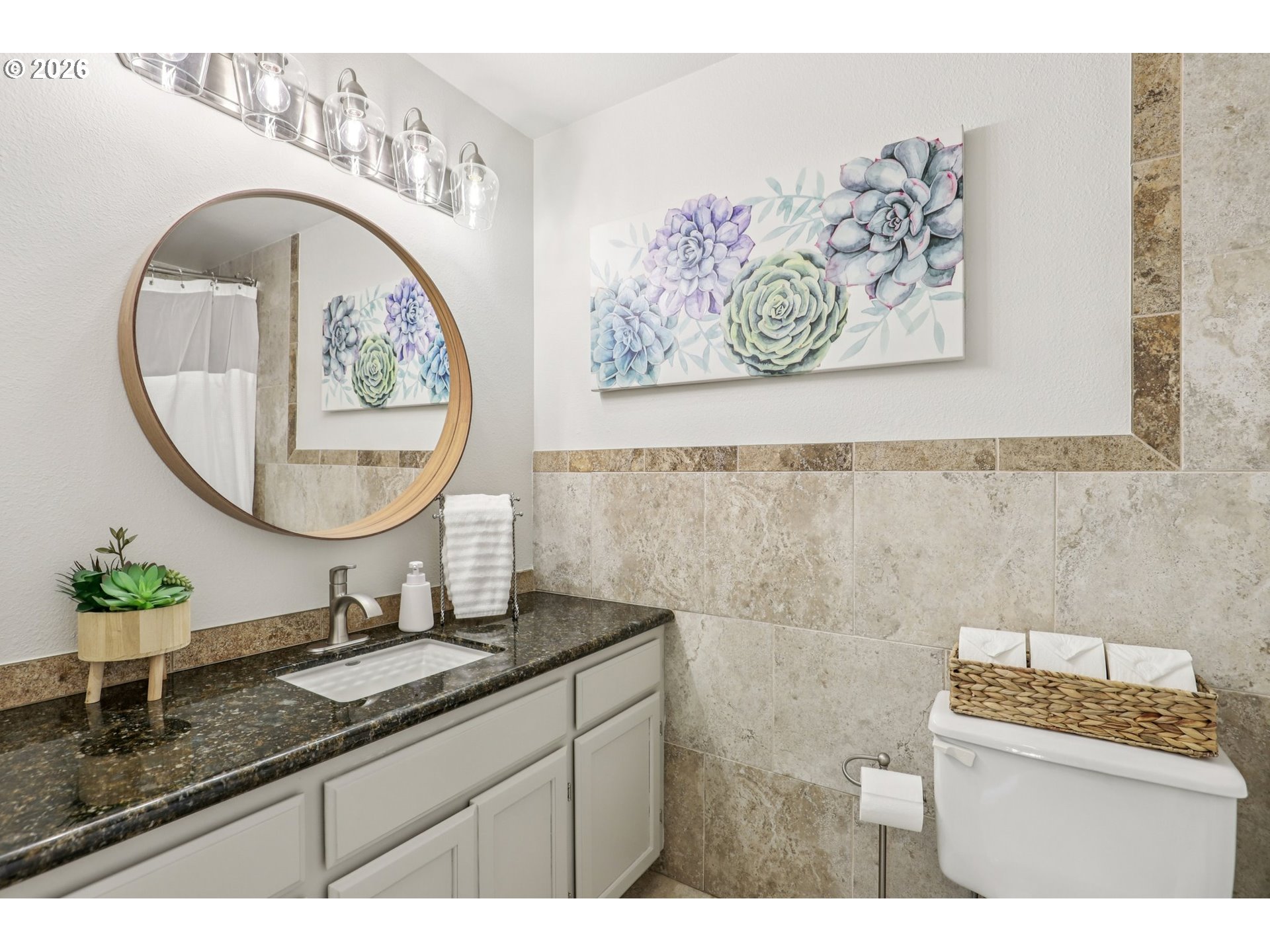 1702 Northeast 70th Street Vancouver, WA 98665 - Photo 28 of 32 a bathroom with a sink and a mirror