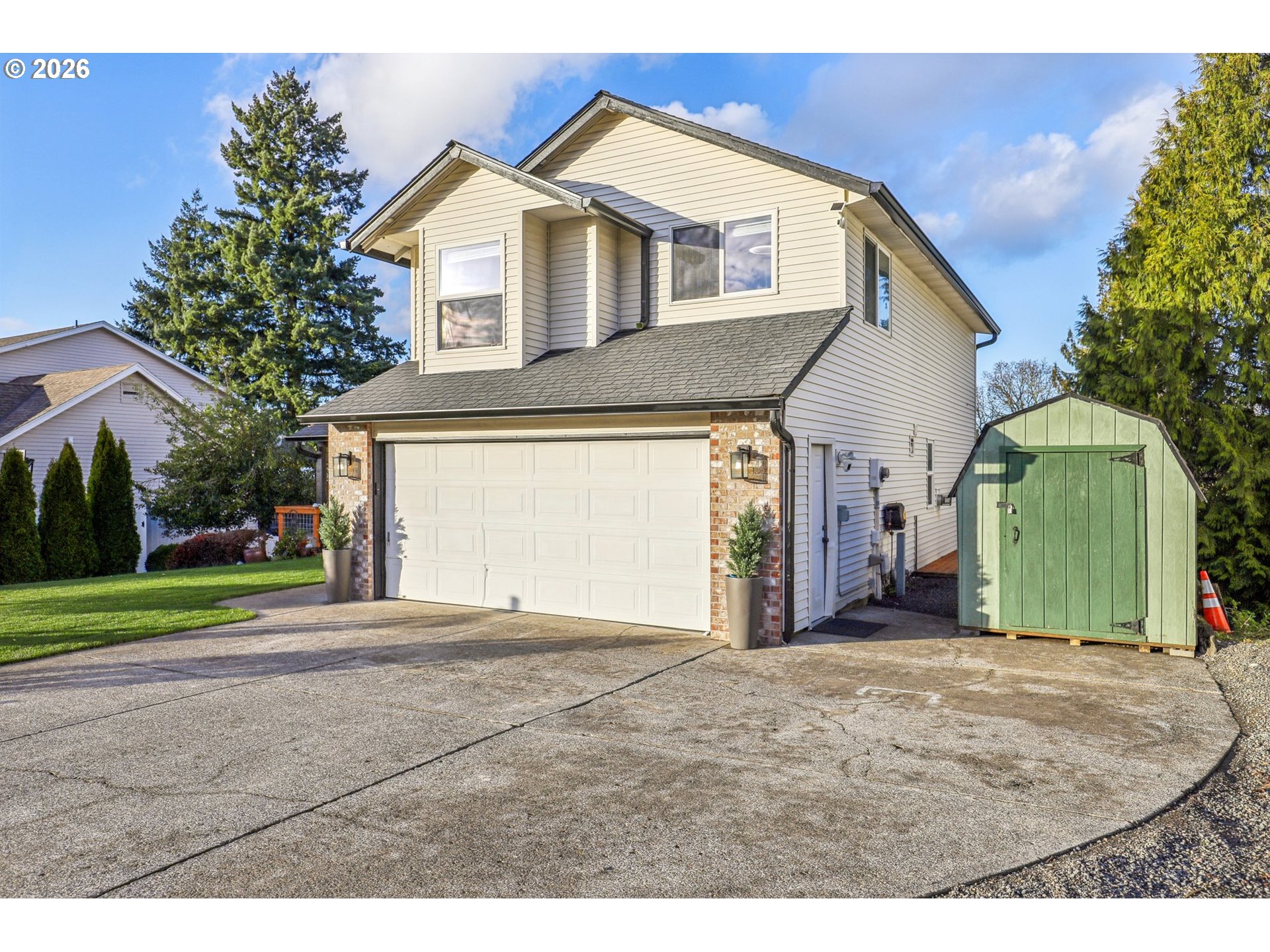 1702 Northeast 70th Street Vancouver, WA 98665 - Photo 3 of 32 a front view of a house with a yard and garage